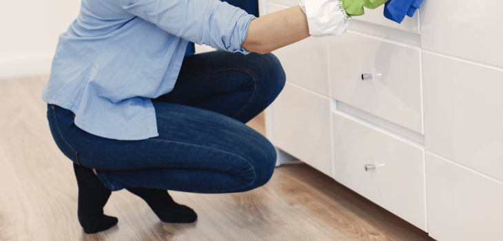 687bb5a6 woman with sponge rubber gloves cleaning house 3.png