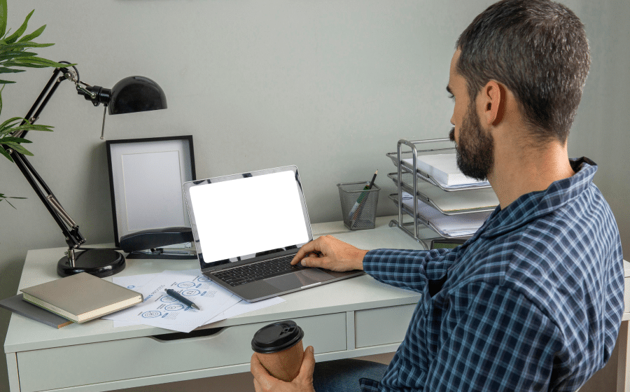 821f1bbe man working from home while having coffee 1.png